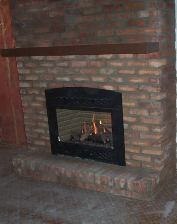 Regency P36 fireplace with Barcelona surround mantel and Red Reclaim brick face.