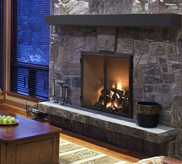 Rutherford wood fireplace with bi-fold doors and traditional brick liner.