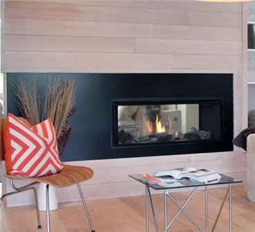L1 Linear 2-Sided Series fireplace shown with Long Beach Driftwood, Fluted Black Liner and 1” Finishing Trim in Black.