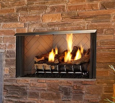 Villa Gas fireplace with herringbone pattern and safety screen.