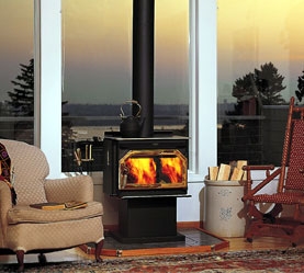 Striker S160 wood stove shown with standard pedestal and 24-karat gold plated traditional door.