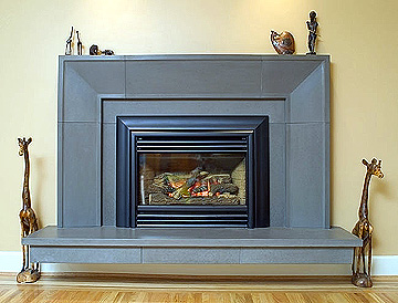 Legend G3 with Steel Front and Contour Black Trim shown with Solus Taper handcrafted concrete surround,  mantel and hearth.