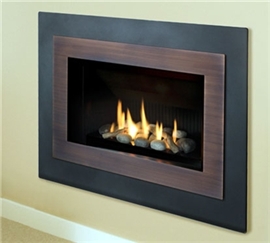 H4 gas fireplace with Landscape surround, Copper inner bezel and decorative rock kit.
